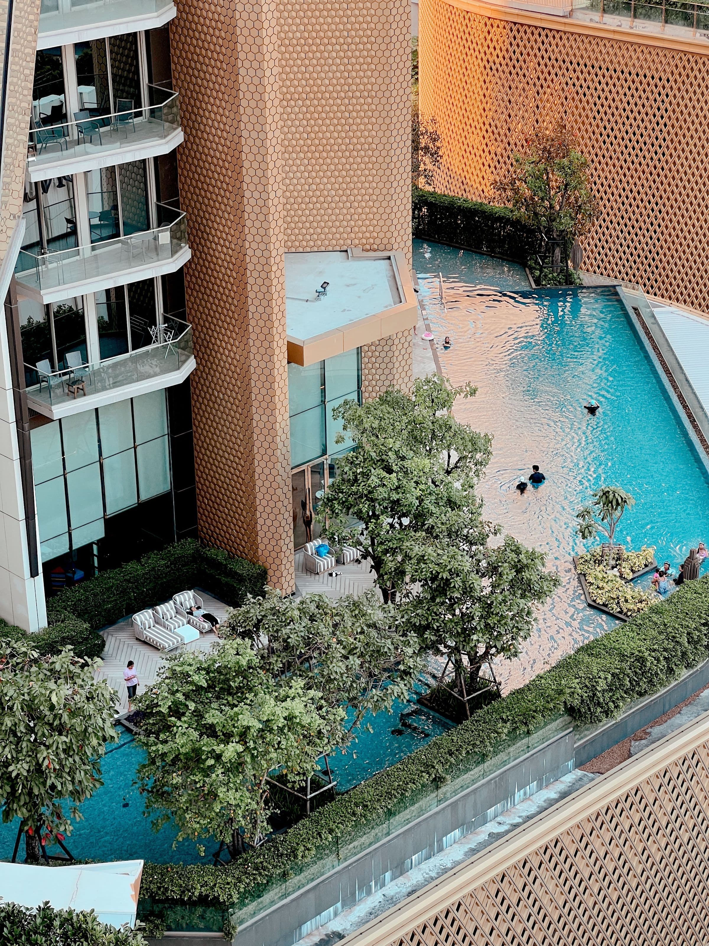 Aerial view of a luxury rooftop pool with city views